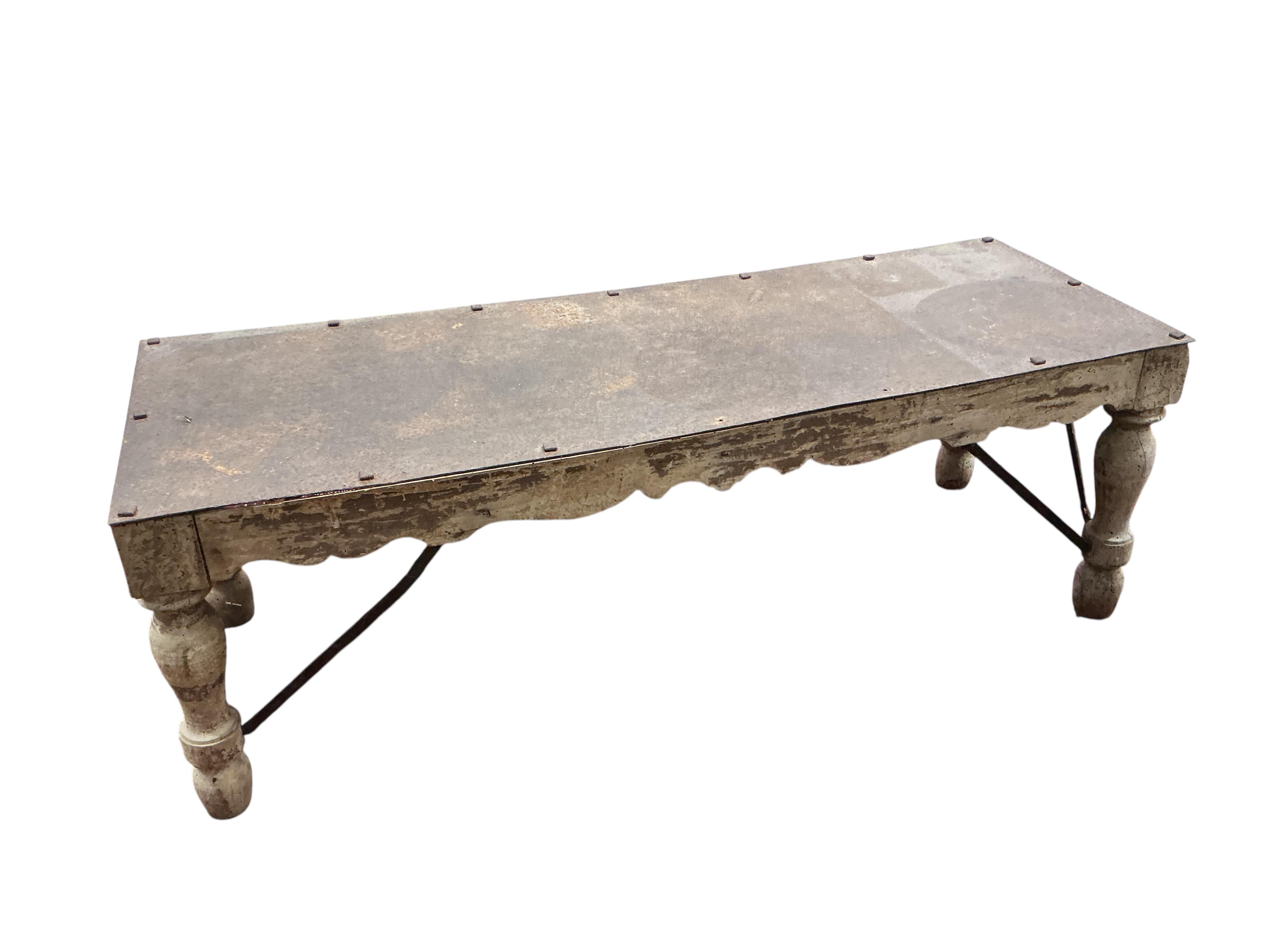 A rectangular bleached wood coffee table with studded iron top, width 130cm, depth 46cm, height 46cm